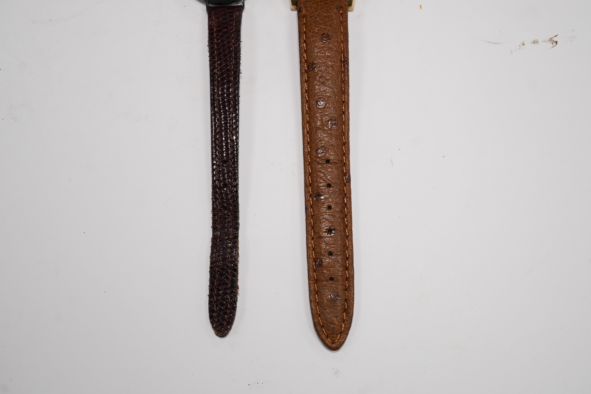 A gentleman's 1940's 10k gold filled Longines Weems? manual wind wrist watch, lacking dial, case diameter 28mm, together with a lady's silver wrist watch. Condition - poor to fair